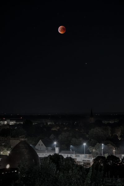 Red moon over the city of Duisburg